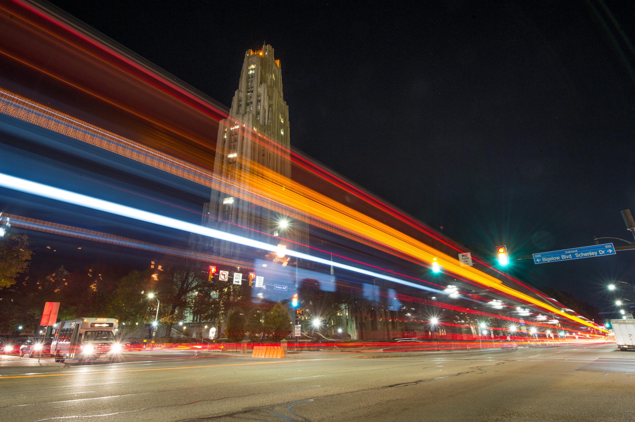  Time lapse photo of Bigelow at night with the Cathedral of Learning in the background