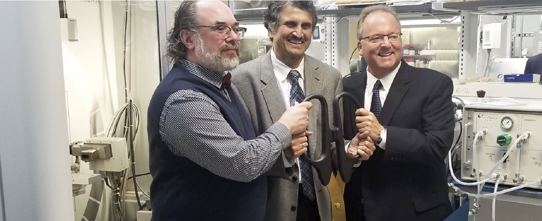 Posing with ceremonial scissors