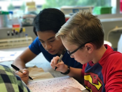 Students working in a workbook