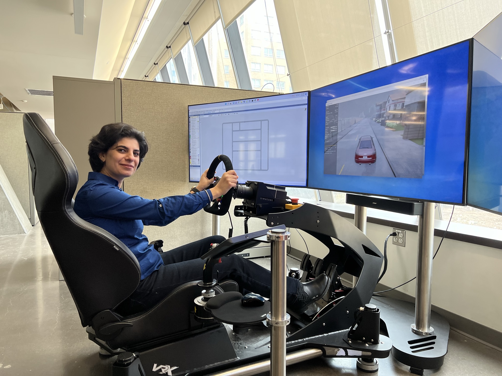 Person using a car simulator