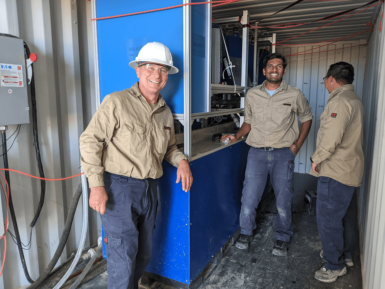 From left: Radisav Vidic, Ritesh Pawar and Zheiwei (Joey) Zhang working on the pilot-scale MD system in Texas.