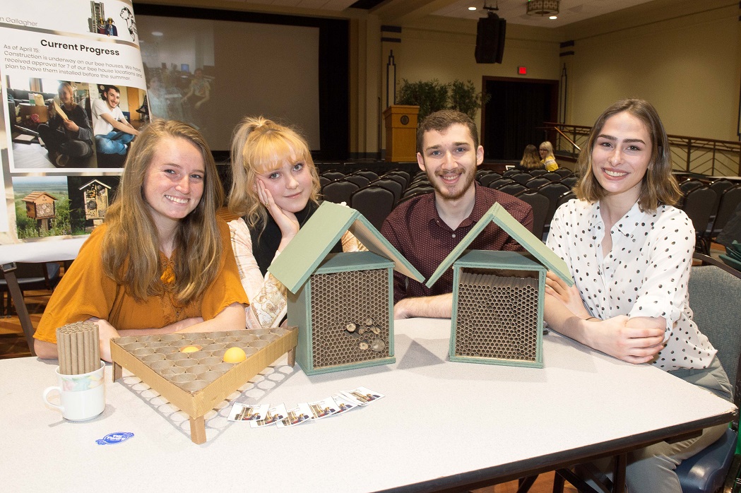 Students with bee houses