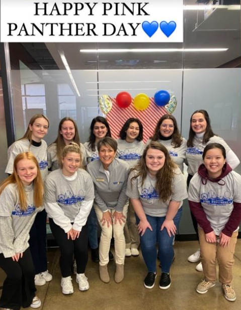 Group of female SSOE Pitt students standing together smiling at an event