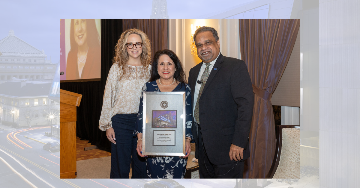 Kim LaScola Needy accepting award