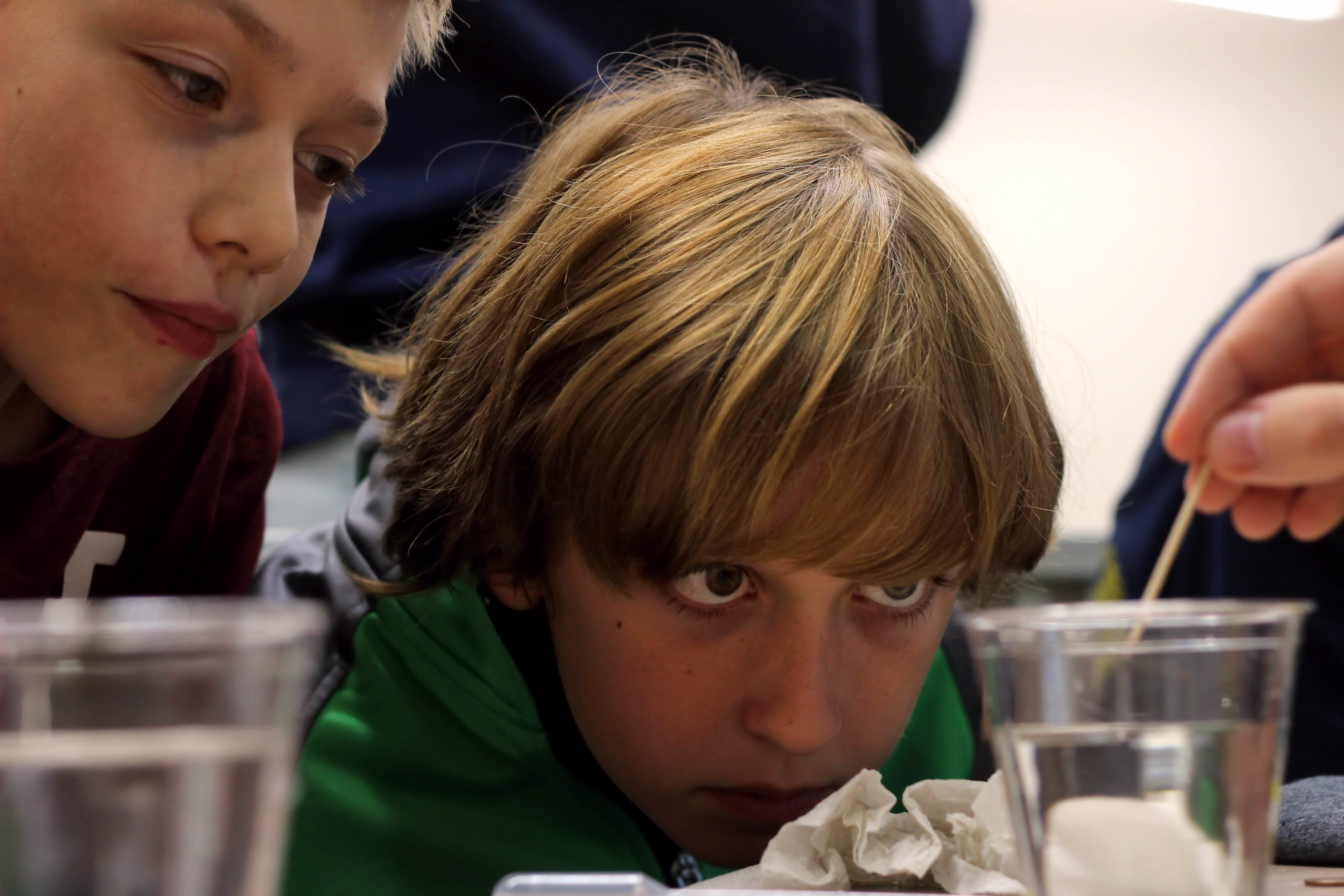 A child doing an experiment with water