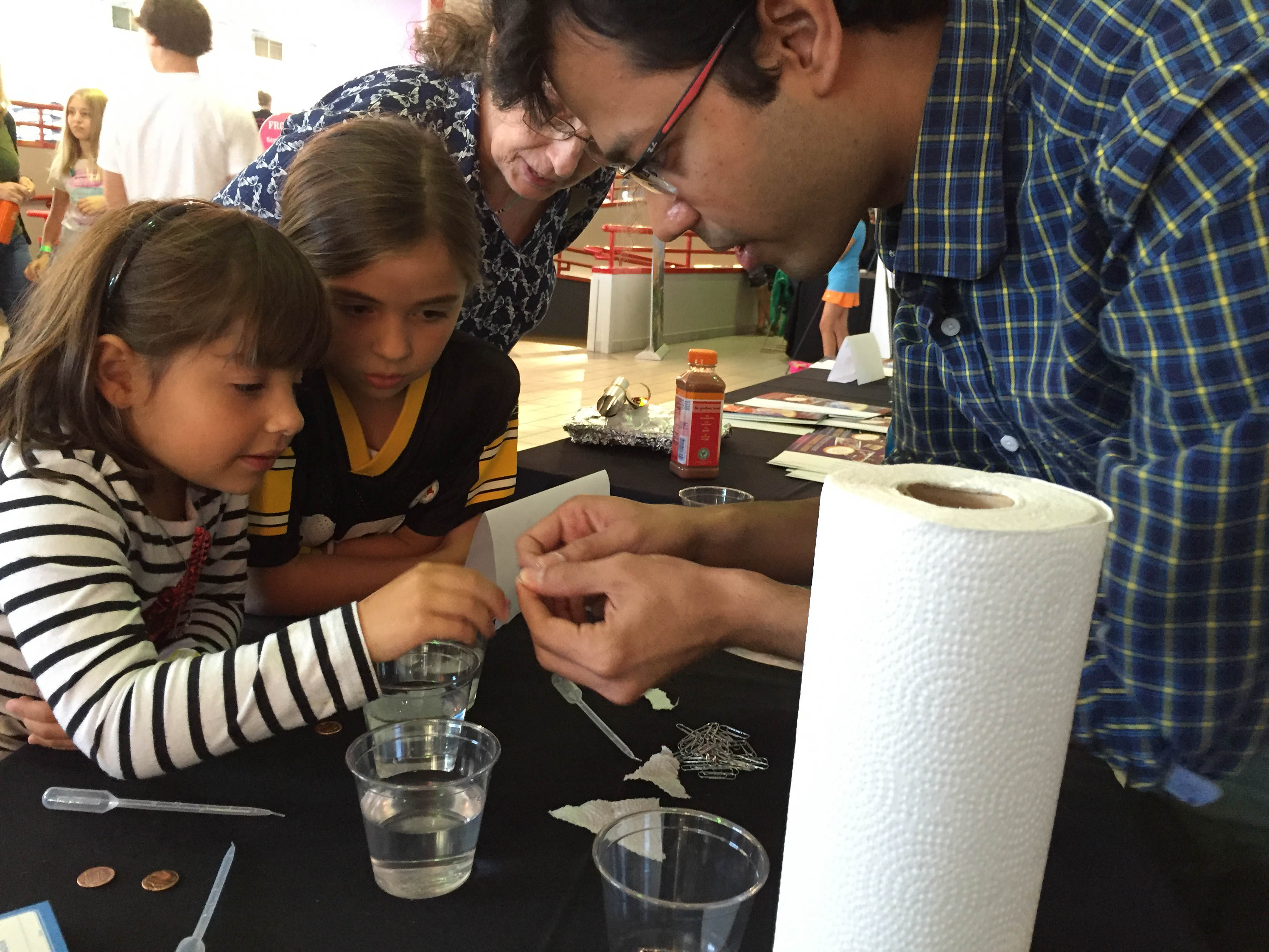 A child doing an experiment with water