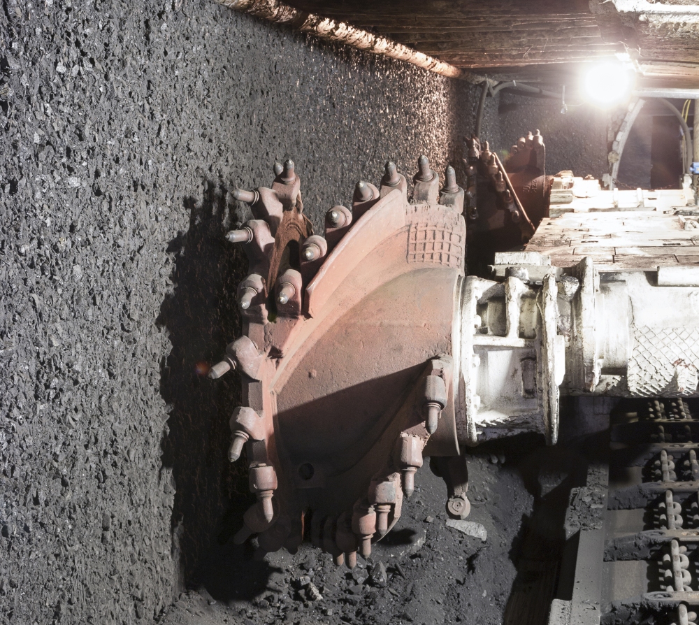 Longwall Mining: Shearer, with two rotating cutting drums and movable hydraulic powered roof supports called shields