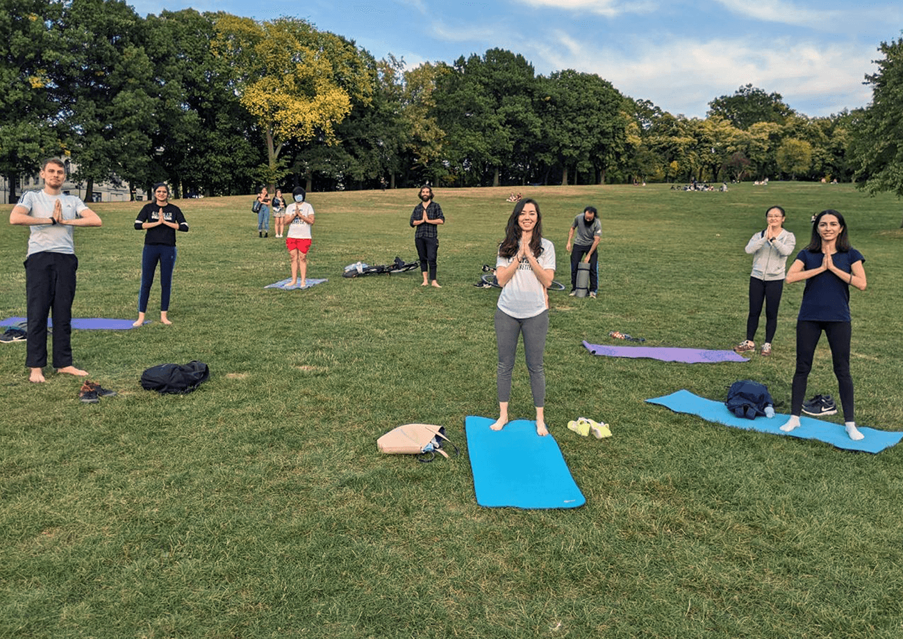 Students doing yoga outside