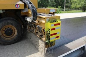 Truck laying concrete on a road