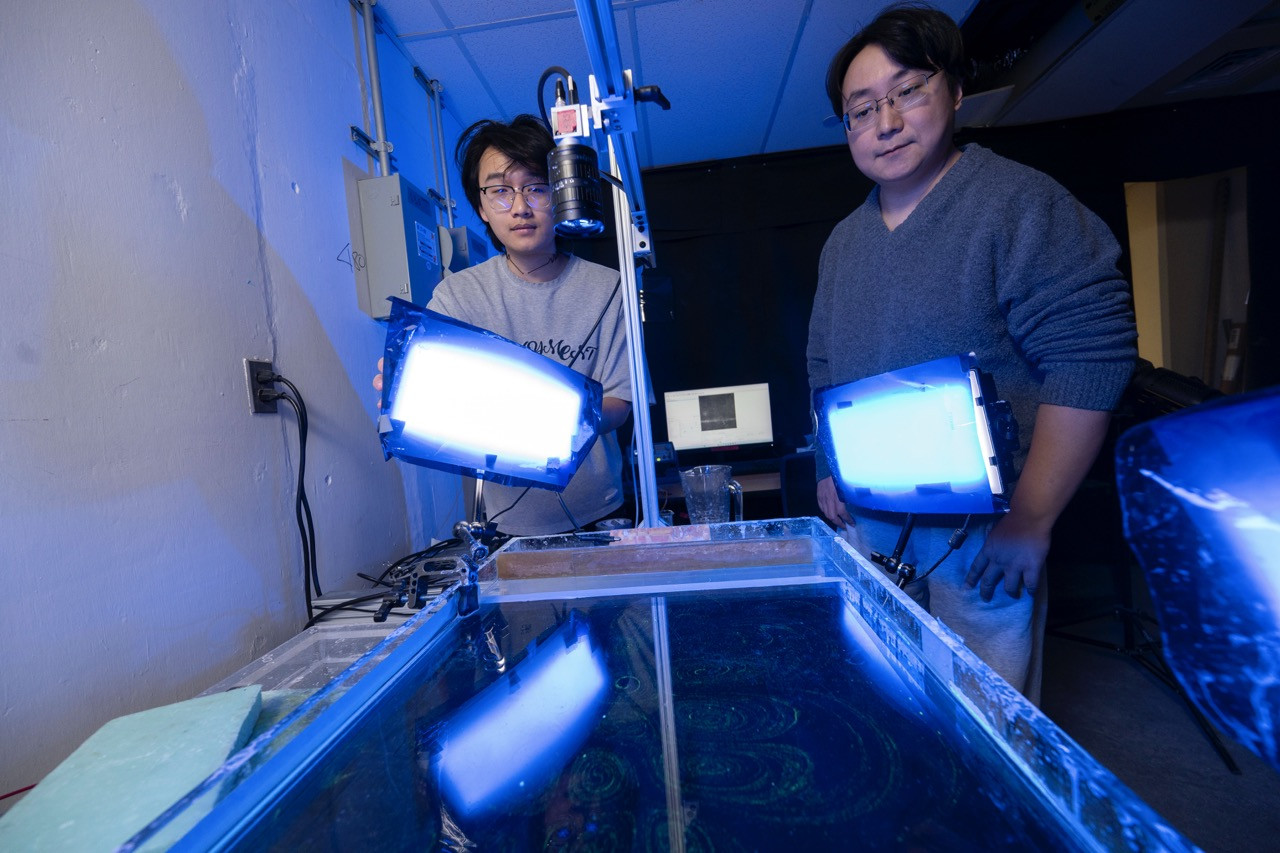 Turbulence Research - Ziyue Yu and Lei Fang generating turbulent flows in a test tank. (Tom Altany) Turbulence Research