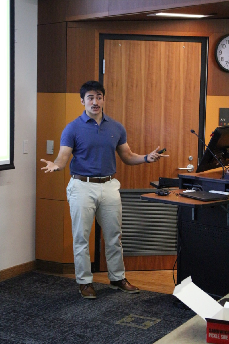 summer internship student presenting in benedum halls lecture room