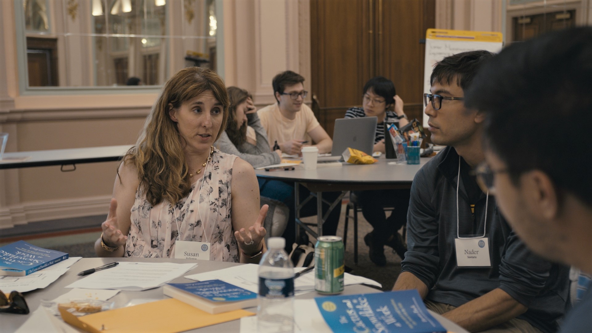 faculty members sitting at a round table discussing