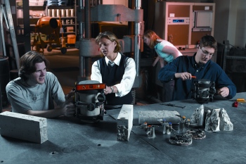 four people working in a lab