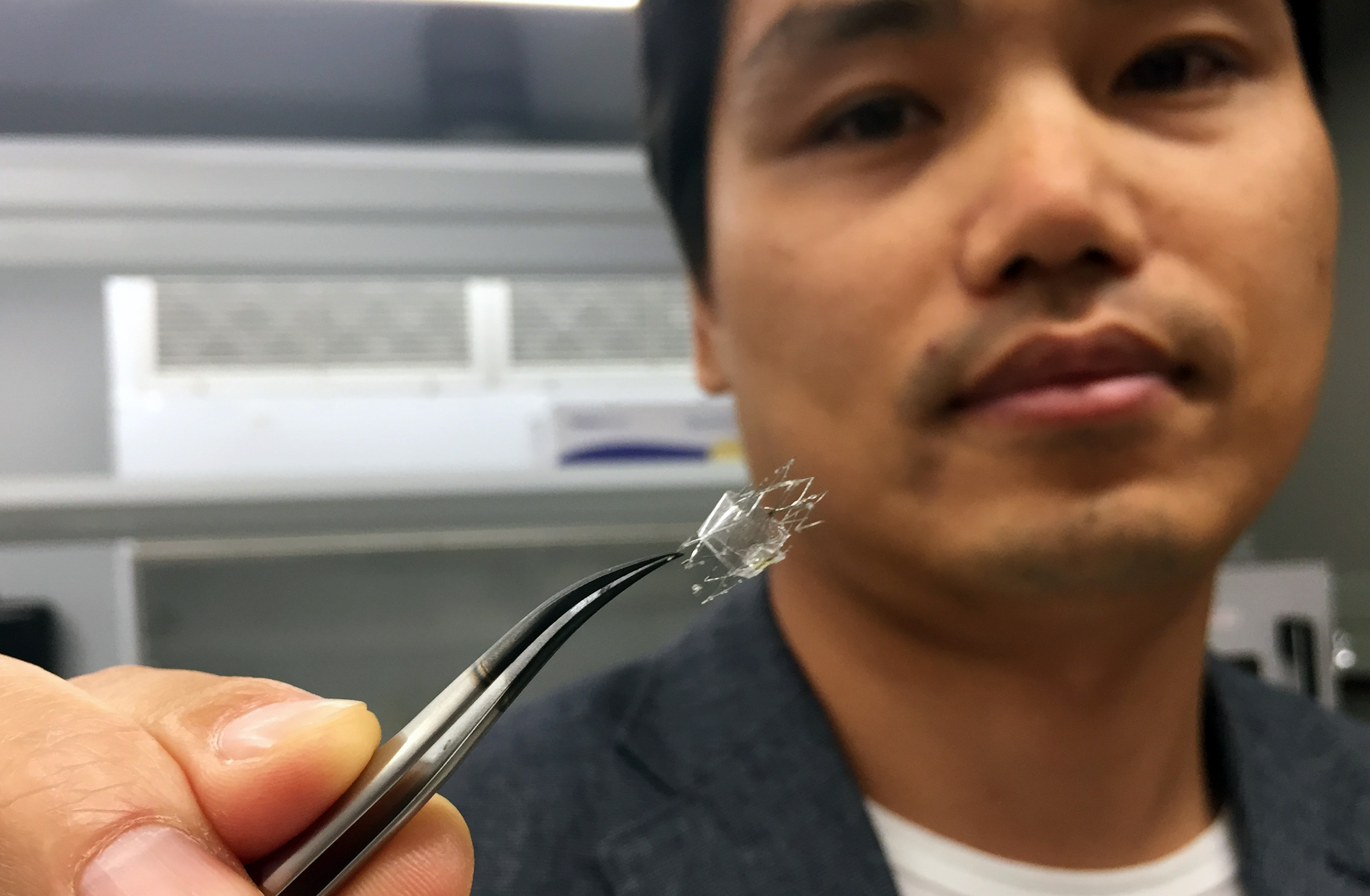 Woon-Hong Yeo, an assistant professor in Georgia Tech’s George W. Woodruff School of Mechanical Engineering and Wallace H. Coulter Department of Biomedical Engineering, holds a flow sensor on a stent backbone (Credit: John Toon, Georgia Tech)