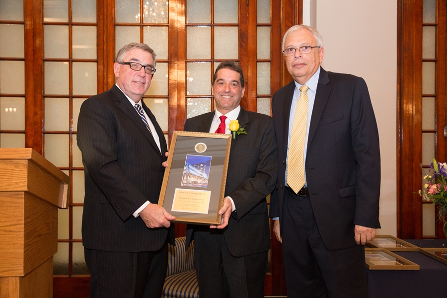 Michael Pietropola Jr. being presented an award