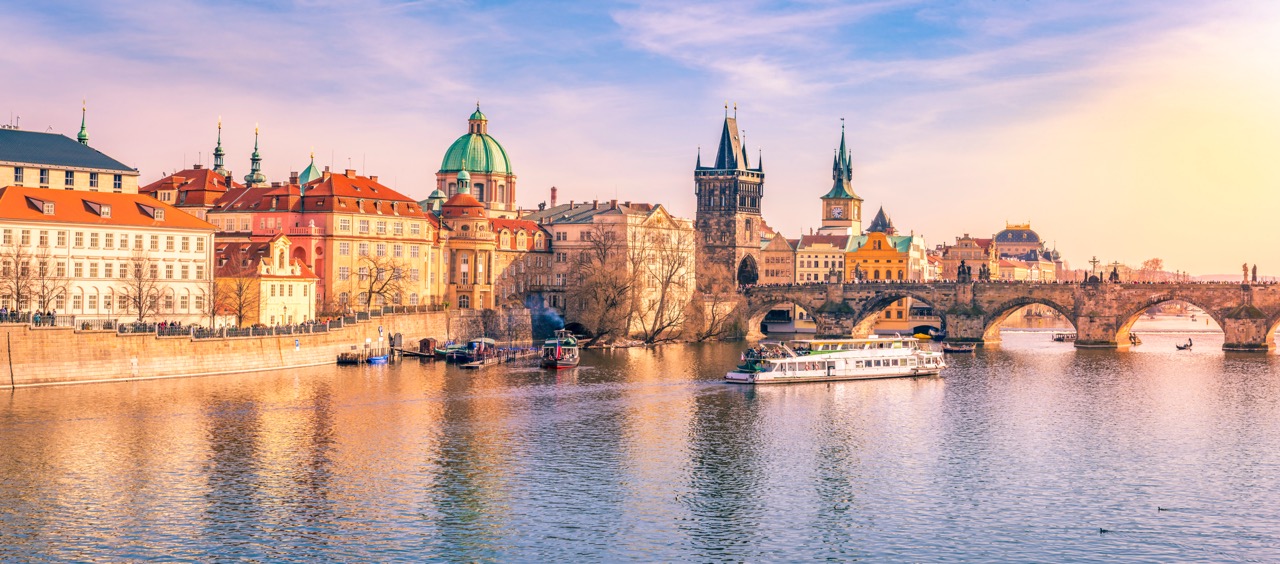 Panorama of Prague city, the capital of Czech Republic, with the Vltava river, the Charles Bridge and  surrounding buildings, on a sunny day of March.