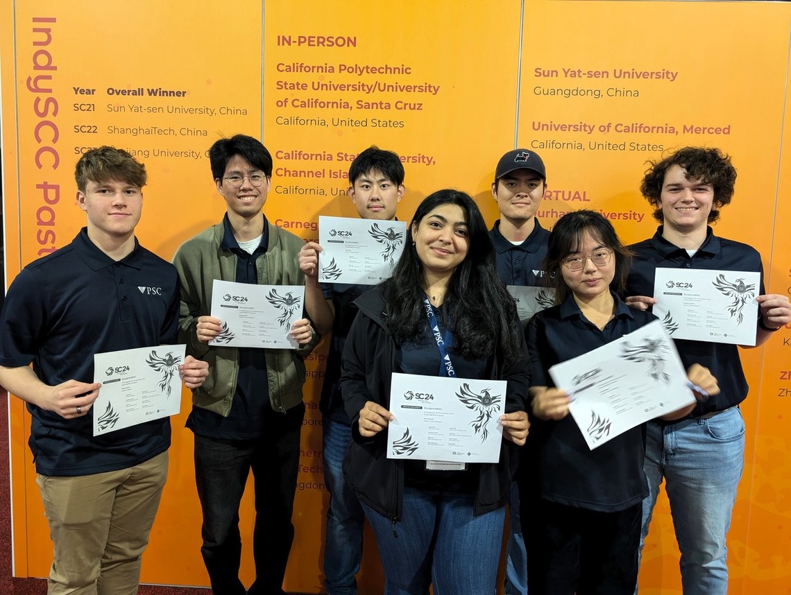 PSC interns pose in front of their project