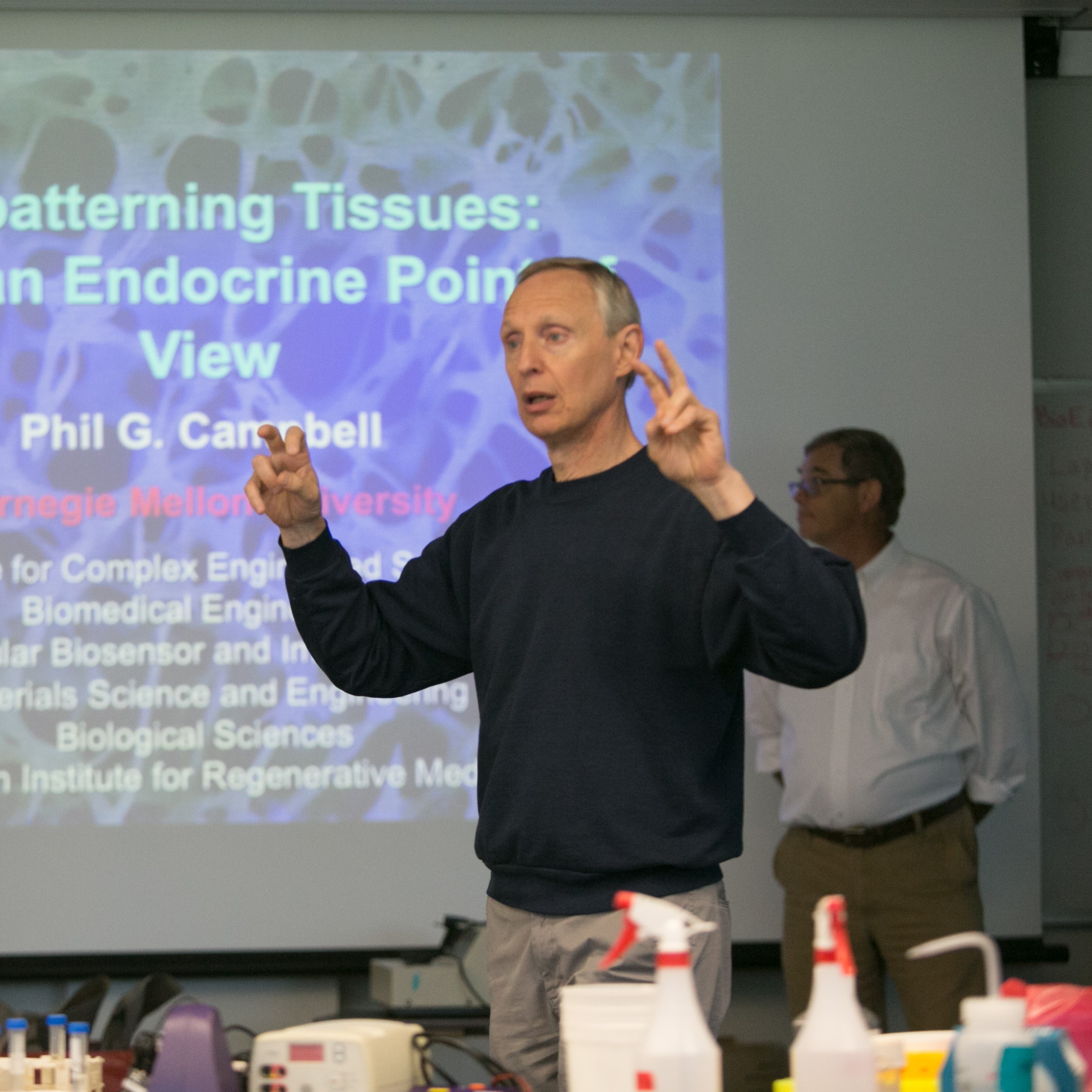 mark speaking in front of a classroom