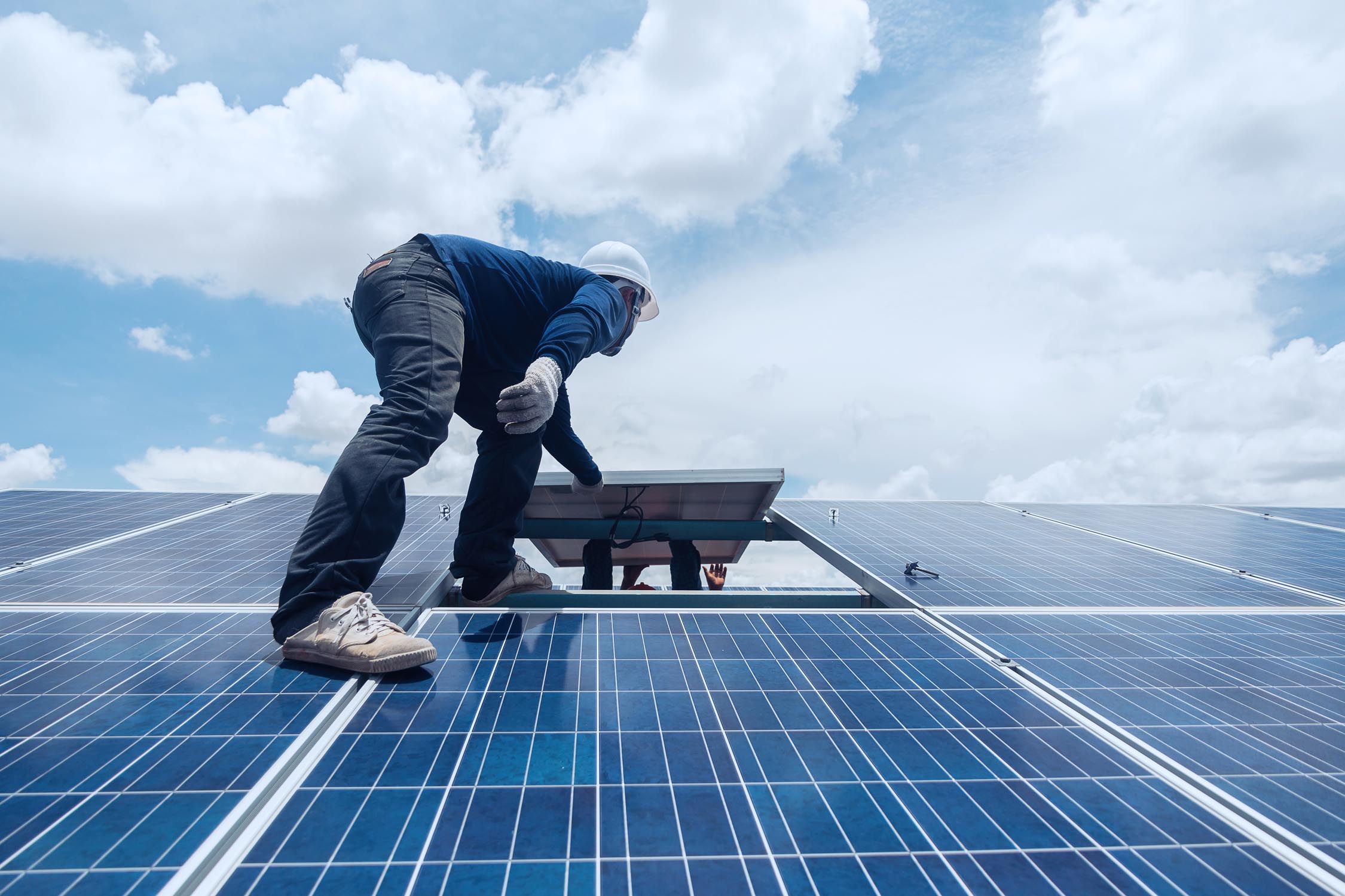 Engineers working on solar panels