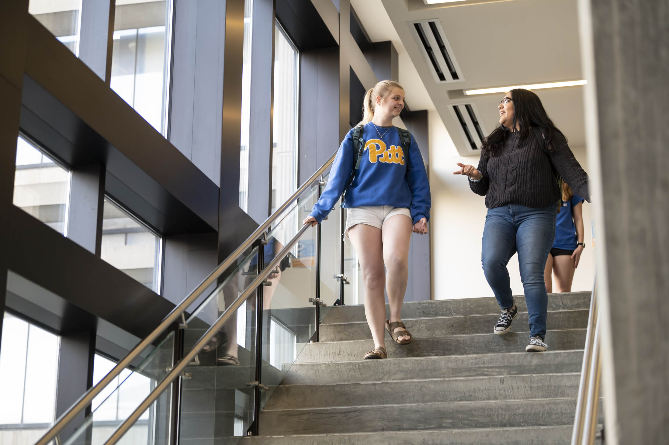 students descending the staircase
