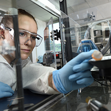  A technician adjusting lab equipment