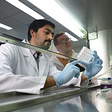  A technician adjusting lab equipment