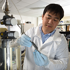  A technician adjusting lab equipment