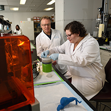  Two technicians working in a lab 