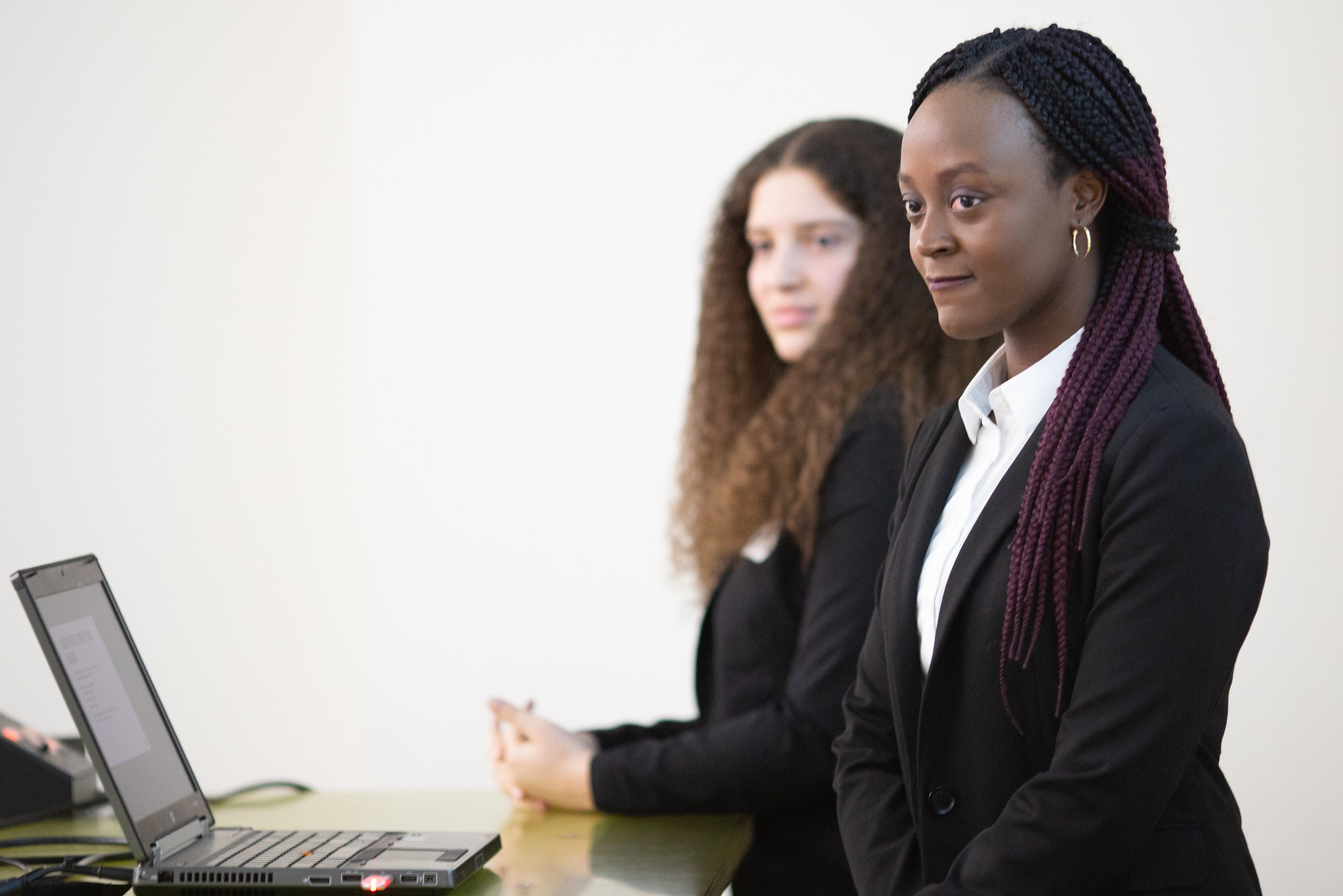 Two students presenting in a classroom