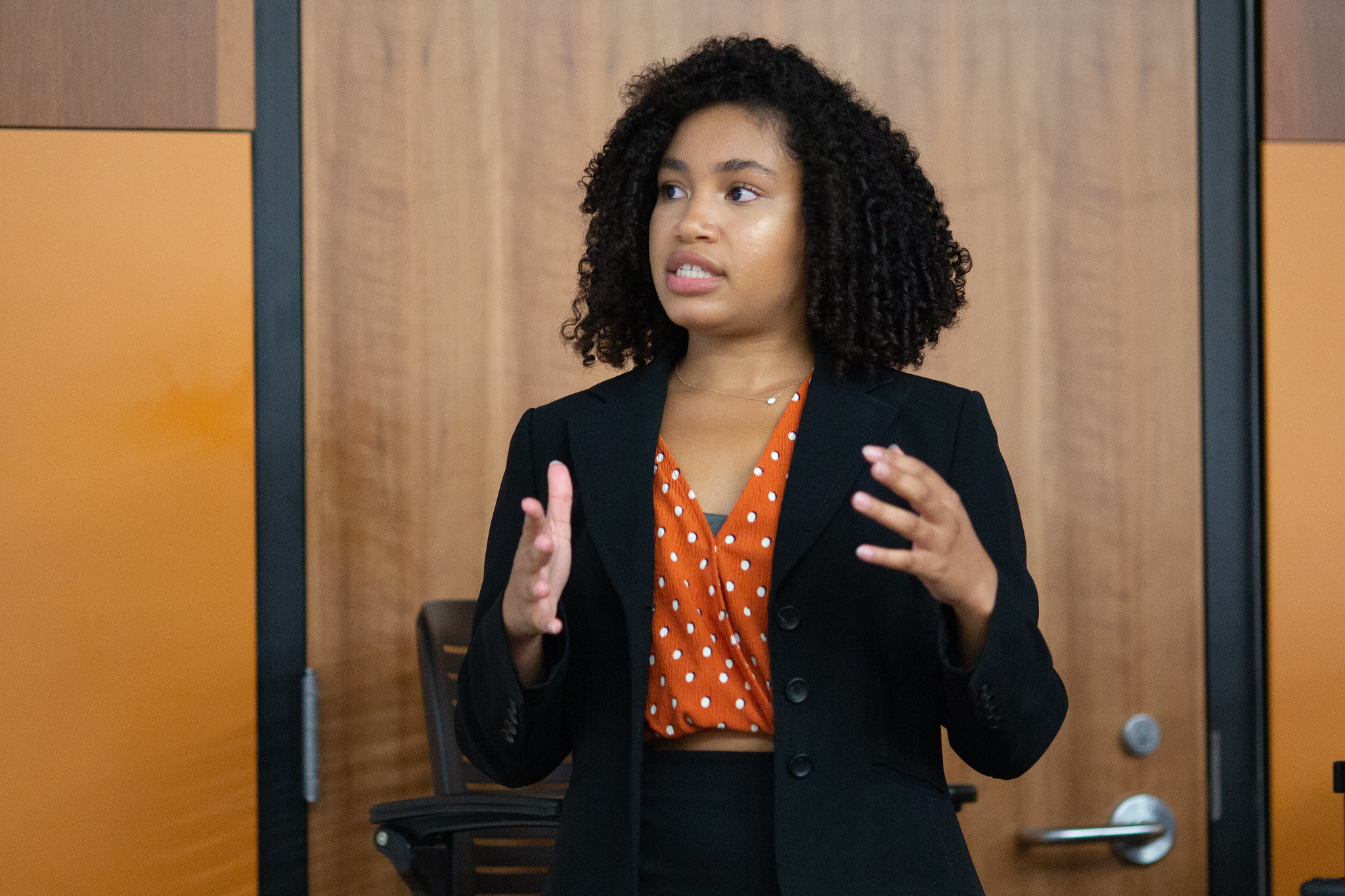 A person talking in front of a classroom