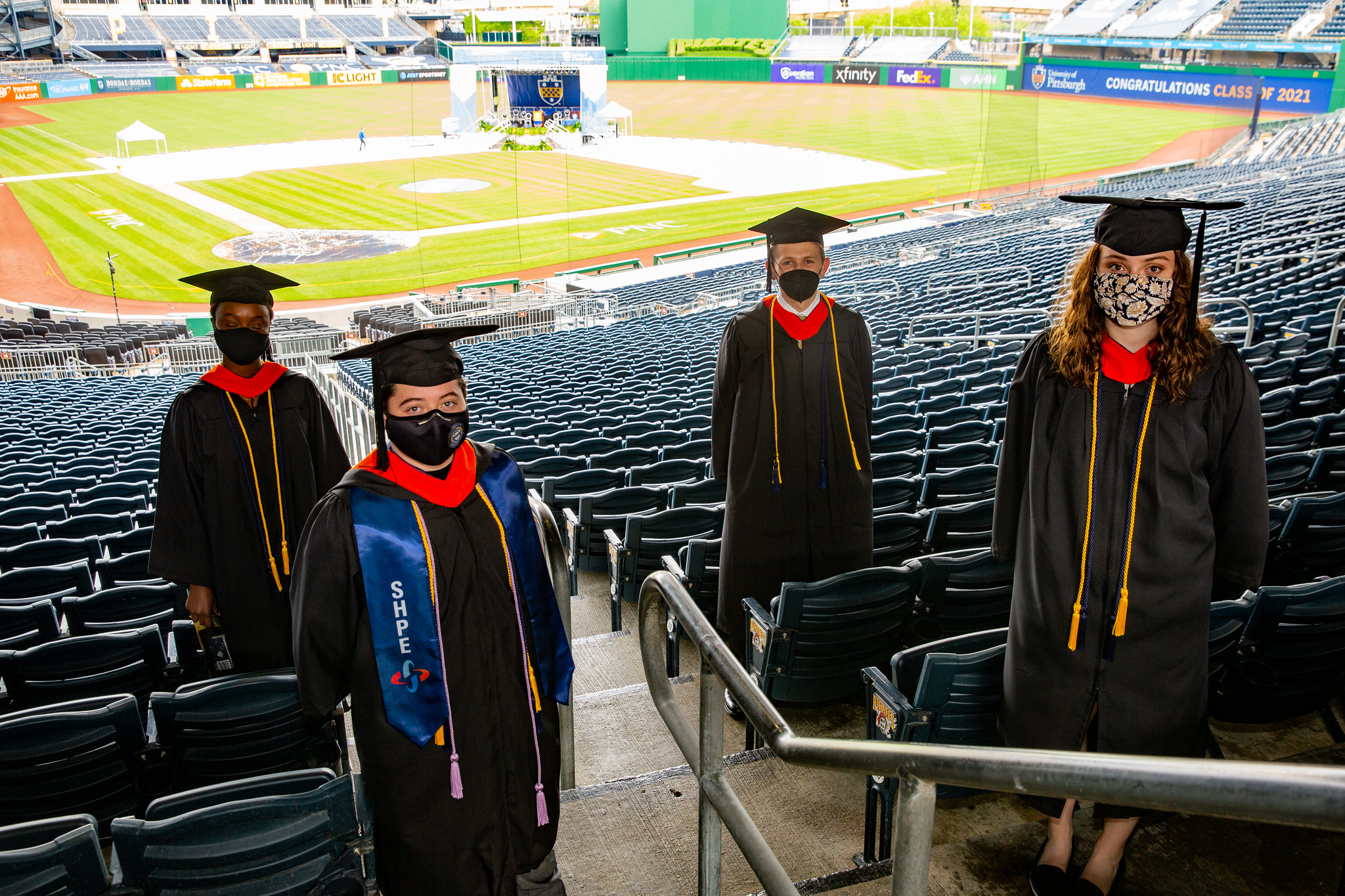 Students in caps and gowns at PNC park