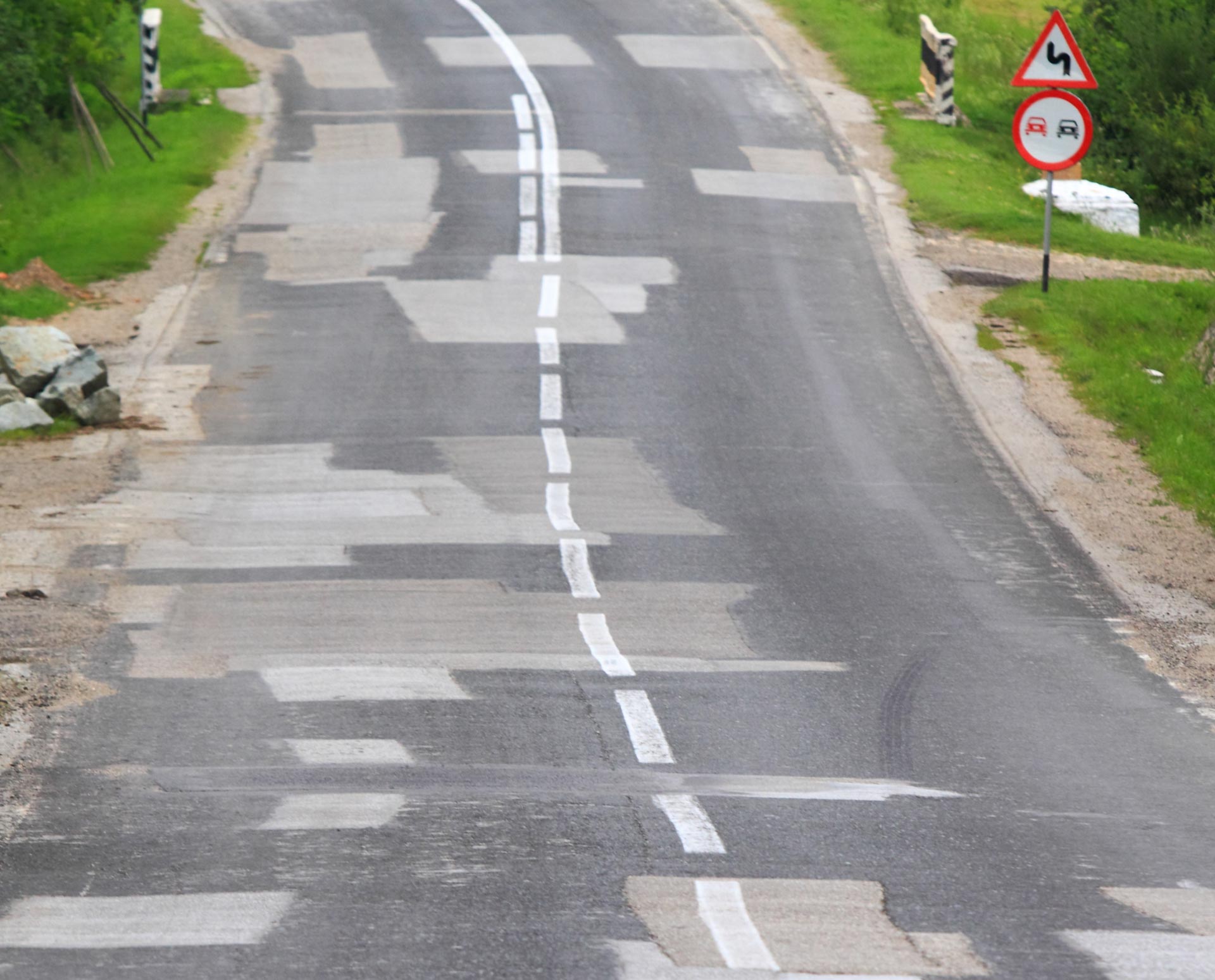  a patched and repaired road  