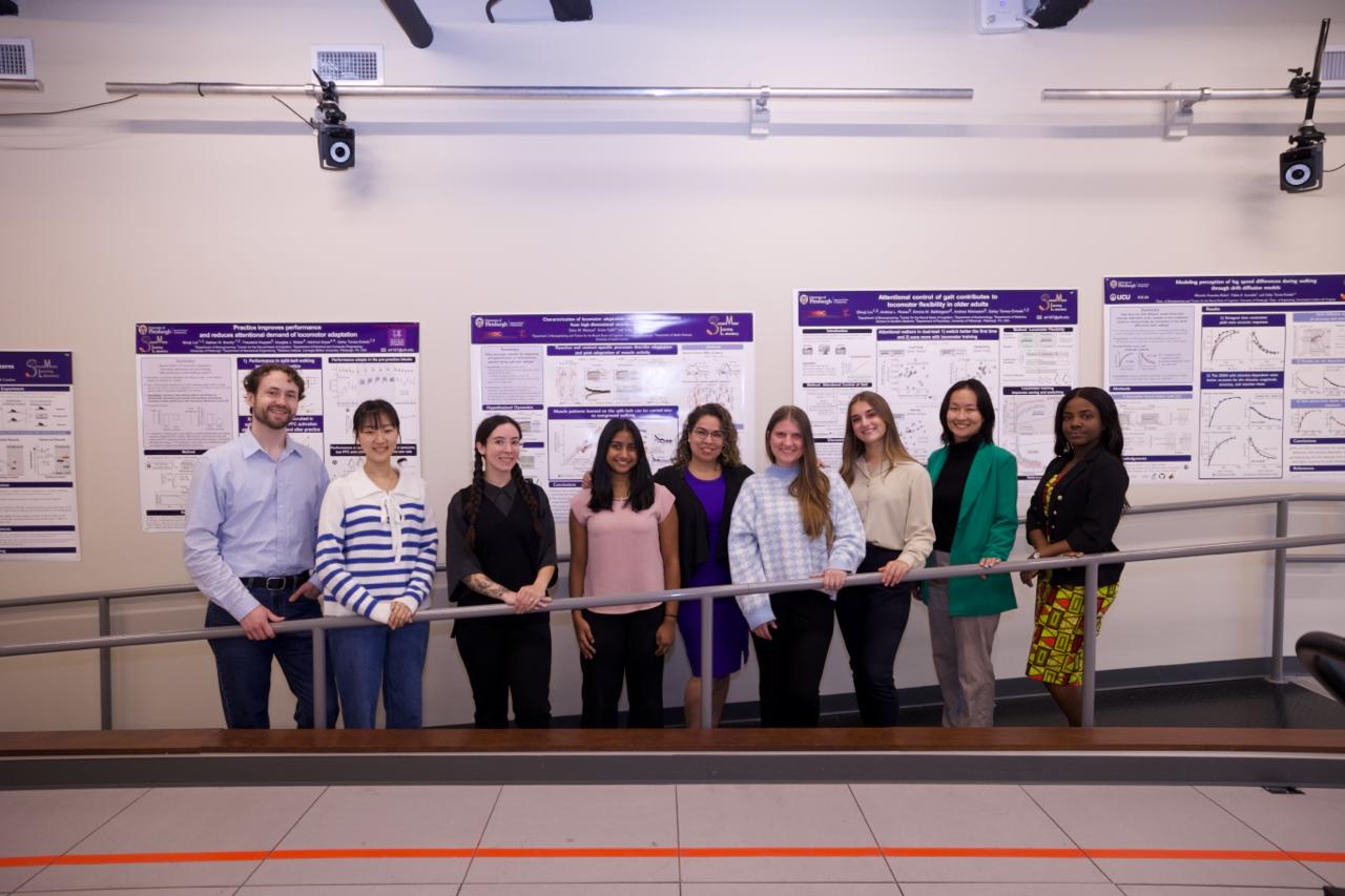 SML group members in front of research posters